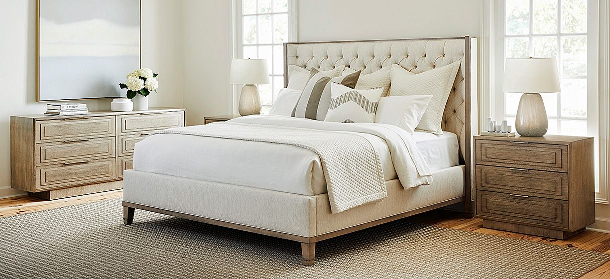 Finely tailored upholstered bed and meticulously crafted case goods.